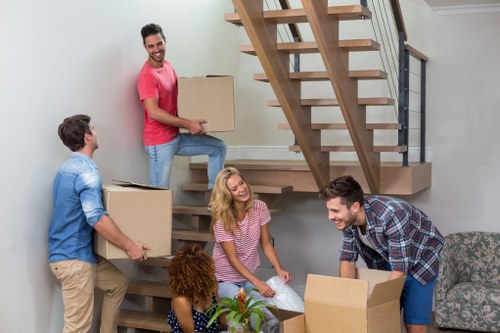 Removal team planning a move in Hammersmith street with residential flats