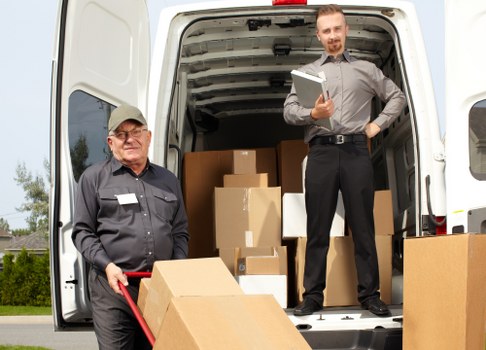 Removal team planning a house move in Hammersmith with boxes and furniture