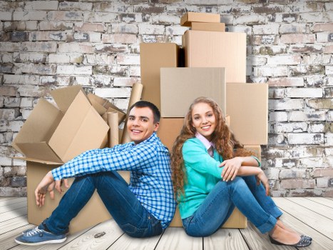 Student removal team helping with boxes in a Hammersmith flat