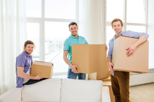 Packed moving boxes ready for a home relocation in a Hammersmith flat