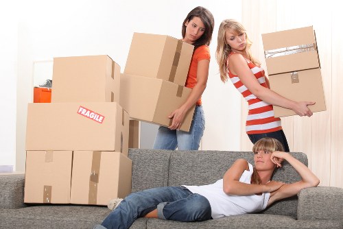 Moving team managing stairs and access during a flat removal in Hammersmith